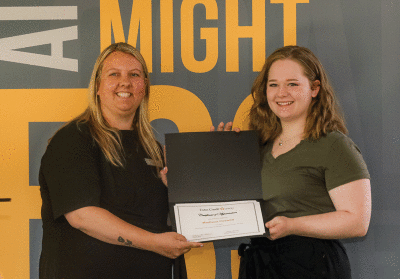  Madison Caswell, who attends University of Michigan-Dearborn, right, receives her award from Cornell. 