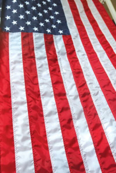  An American flag is displayed inside American Flag and Banner Co. in Clawson. 