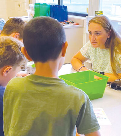  Allisyn Melcher aids students as part of the Teacher Cadet program, an MISD initiative that allows high school students to get real in-classroom experience alongside teachers. 