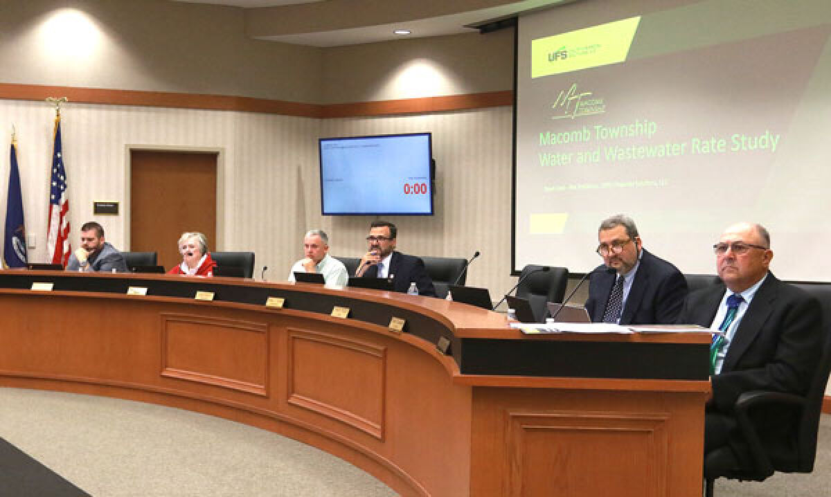  The Macomb Township Board of trustees listens to a speaker during the public comment period at the board’s June 14 meeting. 