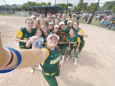  Grosse Pointe North softball celebrates its  9-1 regional title win over Livonia Churchill on  June 10 at Royal Oak High School with a selfie. 