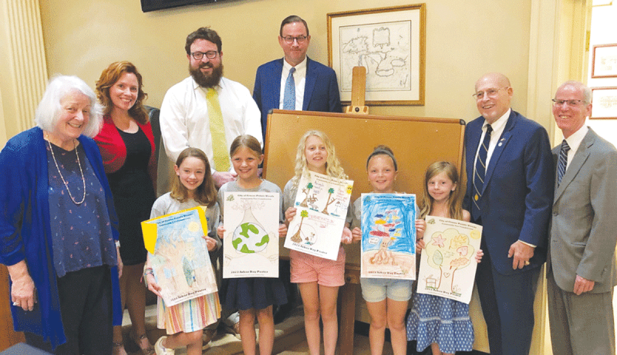  The Grosse Pointe Woods City Council — back row, from left, Vicki Granger, Angela Coletti Brown, Michael Koester, Todd McConaghy, Mayor Arthur Bryant and Thomas Vaughn — congratulate Arbor Day poster contest winners, front row from left, Isabelle Janis, Emmerson Dallaire, Stacey Pennar, Bridget Fiske and Willow Wargo. 