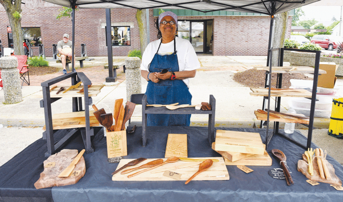  Vivian Sanders, of Surukotoga, shows her wood products at the Berkley Farmers Market last week. Surukotoga is Japanese for “to be.” 