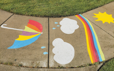  Colorful chalk art adorns the sidewalk next to the pavilion. 