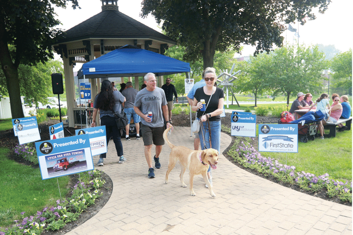  Joe and Shelley Cimino, of Sterling Heights, attend  Patios N’ Pints with their 3 1/2 year old dog, Stella, at Upton House July 3.  
