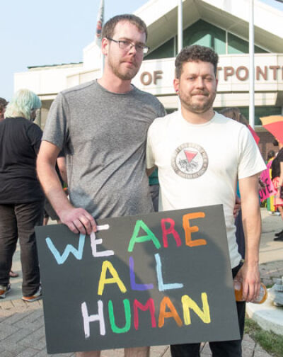  Eastpointe resident Timothy Kniaz, right, with husband Nick Gevedon, left, organized the Pride Protest in front of Eastpointe City Hall June 28. 