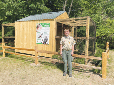  Andrew England, a Boy Scout from Troop 1478, volunteered to build an enclosure for the red-tailed hawk for his  BSA Eagle Scout service project. 