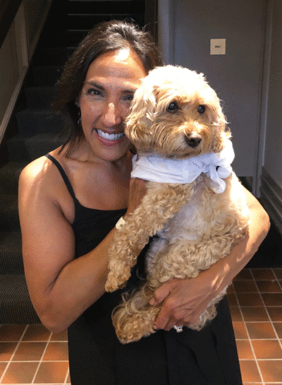  Grosse Pointe Shores resident Dana Owen holds Maddie, her cockapoo. Owen and her husband were injured in a recent attack by a dog on Maddie that cost Maddie one of her front legs. 