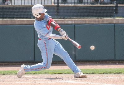  Grosse Pointe Woods University Liggett senior catcher Oliver Service delivers a hit during the Michigan High School Athletic Association Division 2 State Finals. 