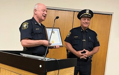  Former Rochester Police Chief Steve Schettenhelm talks about new Rochester Police Chief George Rouhib during his swearing-in ceremony. 