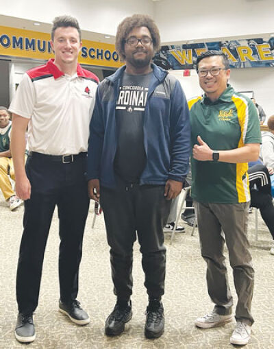  Concordia University Ann Arbor program assistant varsity esports coach Zach Yoder, left; esports scholarship recipient Damitre Johnson; and Clinton Loh, site coordinator for Wayne State University’s C2 Pipeline program at Clintondale High School, stand together to celebrate Johnson’s scholarship to Concordia to play “Super Smash Bros. Ultimate.” 