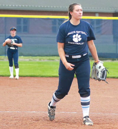  Macomb Dakota senior Megan Nuechterlein controls the mound during a team practice. 