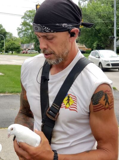  Jack Huffman was transporting Nikki, a dove who was to be released at the Salute Our Warriors event at Rochester Hills the next day. Nikki is trained to return to her handler’s home after being released. 