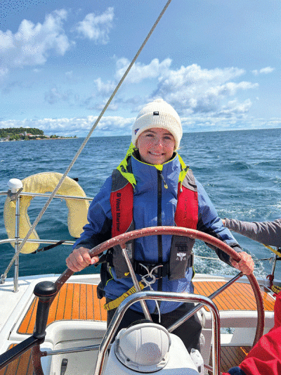  Erin DeGrazia sails over the finish line at the 2023 Bayview Mackinac Race. 