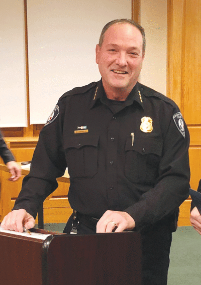  Grosse Pointe Park Public Safety Director Bryan Jarrell is all smiles as he presents awards to members of the department for outstanding work during a Feb. 13 Park City Council meeting. 