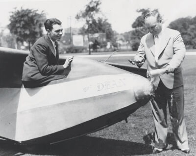  The founder of LTU, Russell Lawrence, is shown using a bottle of Prohibition-legal wine to christen a glider designed by student Jack Laister in the cockpit. The plane was named “The Dean” in Lawrence’s honor. 
