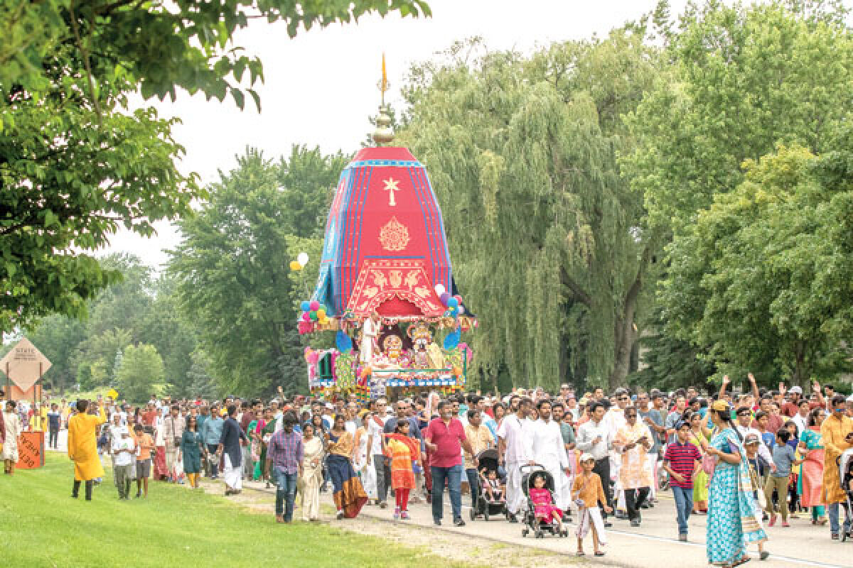  Festivalgoers parade down Taft Road in Novi while pulling a 40-foot-tall chariot carrying the Hindu deities of Jagannath, Balarama and Subhadra during the 38th annual Festival of Chariots July 23. 