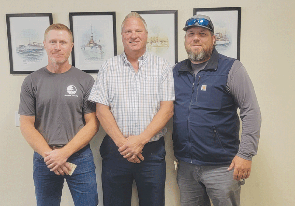  As David Axtell, center, leaves the job of Harrison Township’s public services director, Water and Sewer Supervisor Justin Murphy, left, was promoted to public services director while Jeff Ryan becomes the new water and sewer supervisor.  