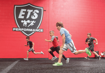  Englebert Training Systems athletes in the speed-plus program, which is typically tailored for 8- to 12-year-olds, work on strength and speed drills. 