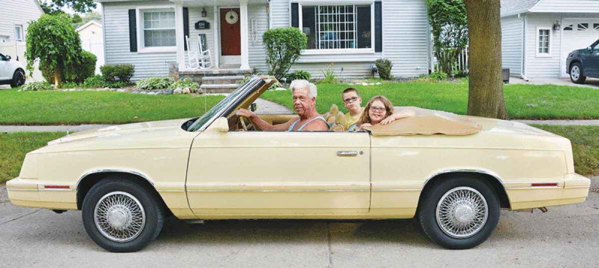  Guy Copland will be driving in his 1982 Chrysler LeBaron convertible with his grandchildren, Nora Sumrall, 7, and Eli Sumrall, 10, during the Berkley CruiseFest Classic Car Parade on 12 Mile Road Aug. 18. 