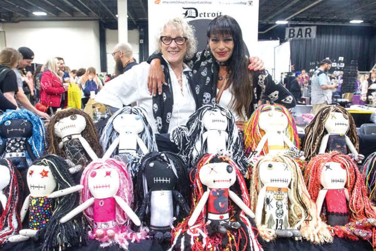  Doreen Defauw and Piper Shano, co-owners of CreepyNCute Shop in Oakland County, pose with an assortment of CreepyNCute dolls they were selling at the Oddities & Curiosities Expo at the Suburban Collection Showplace in Novi July 15. 