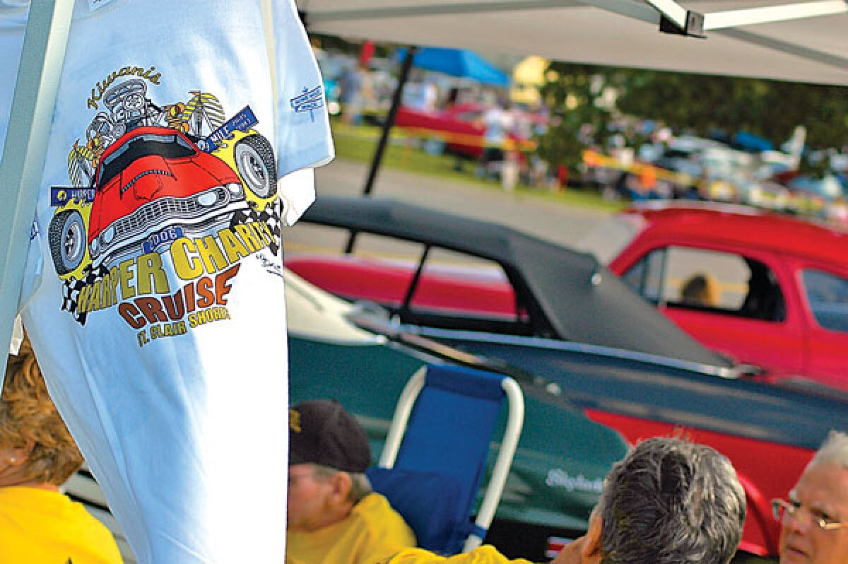 A T-shirt for sale is displayed by Kiwanis members during the 2006 edition of the Harper Charity Cruise. 