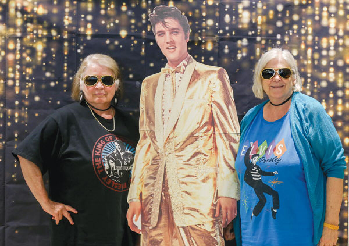  Sisters Kathy Bledsoe, left, and Cindie Bledsoe, right, both of Roseville, were among the Elvis Presley fans who attended the Recreation Authority of Roseville and Eastpointe Summer Day Camp Aug. 8. 