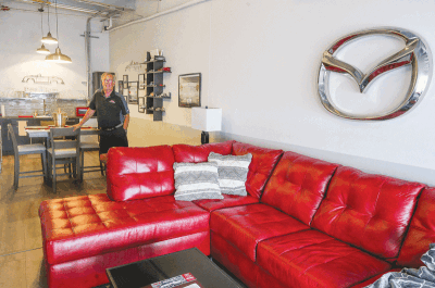  Tom McDonald, of Rochester Hills, has decorated this garage condominium at the M1 Concourse to reflect his love for cars. 