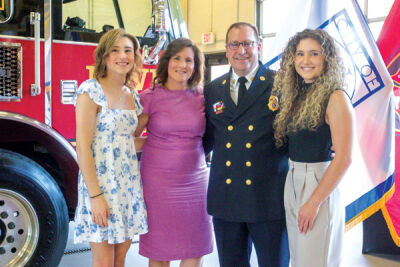  Novi Fire Chief John Martin’s wife, Renée, and daughters, Lindsey and Hannah, attend his promotion ceremony Aug. 8. 