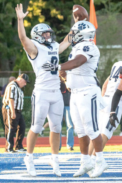  Dakota running back Brady Hamby celebrates a successful 2-point conversion to give Dakota a 10-7 lead early in the game. 
