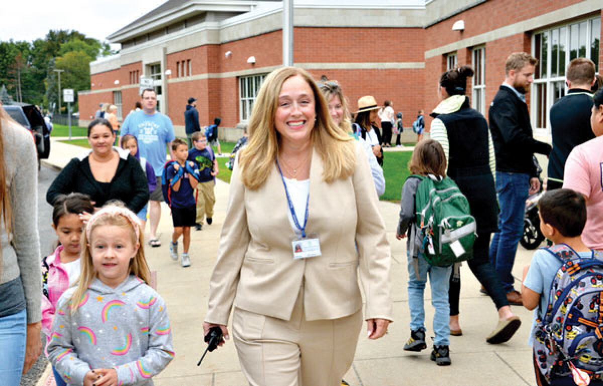  Molly Bascom-Keller walks to the entrance of Northwood Elementary School alongside students Aug. 30. 
