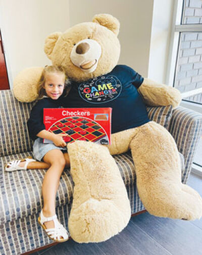  Six-year-old Harper of Rochester Hills poses with Freddy the Teddy to prepare for the “Be a Game Changer’ collection drive to benefit the Children’s Hospital of Michigan. 