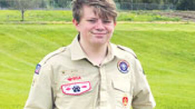  Troy youths help community to complete Scouting experience 