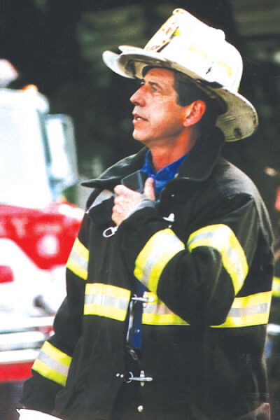  Fire Department of New York Deputy Chief Charlie Kasper helped Siracusa become a talented tennis player decades ago. Siracusa today coaches others in memory of Kasper, who died on Sept. 11, 2001. 