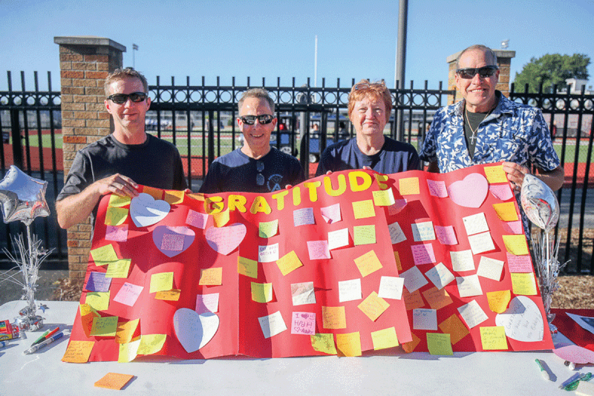  Hazel Park Youth Assistance members Brandon Stinnett, Steve Morton, Beverly Hinton and Andy LeCureaux hold up a “gratitude board” during the Hazel Park Hometown Huddle at Hazel Park High Aug. 31. Attendees were invited to write things they’re thankful for and attach them to the board. HPYA is currently celebrating 70 years of service to the community. 