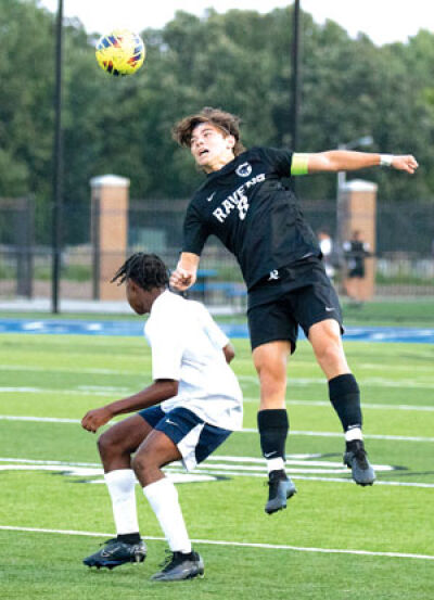  Royal Oak senior Anthony Antonio heads the ball during the team’s matchup against Farmington on Sept. 12 at Royal Oak High School. 