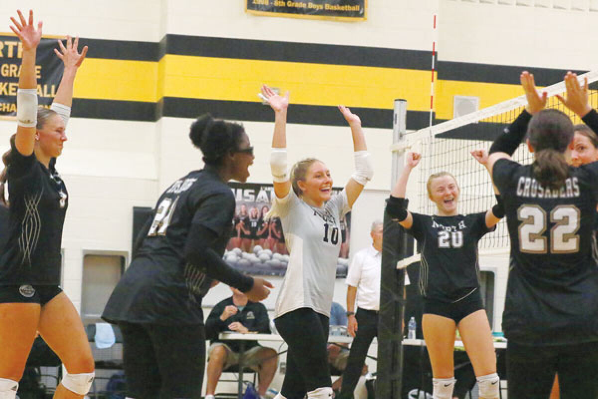  L’Anse Creuse North celebrates during a win against Romeo on Sept. 13 at L’Anse Creuse Middle School-North. 