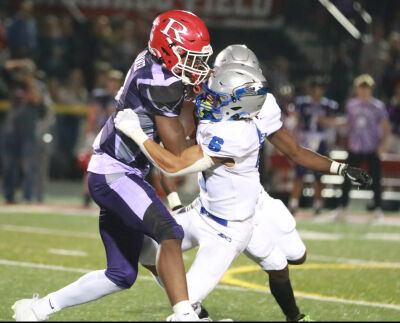  Romeo running back Victor Earl and Eisenhower defensive back Bryce Hurley go head-to-head. 