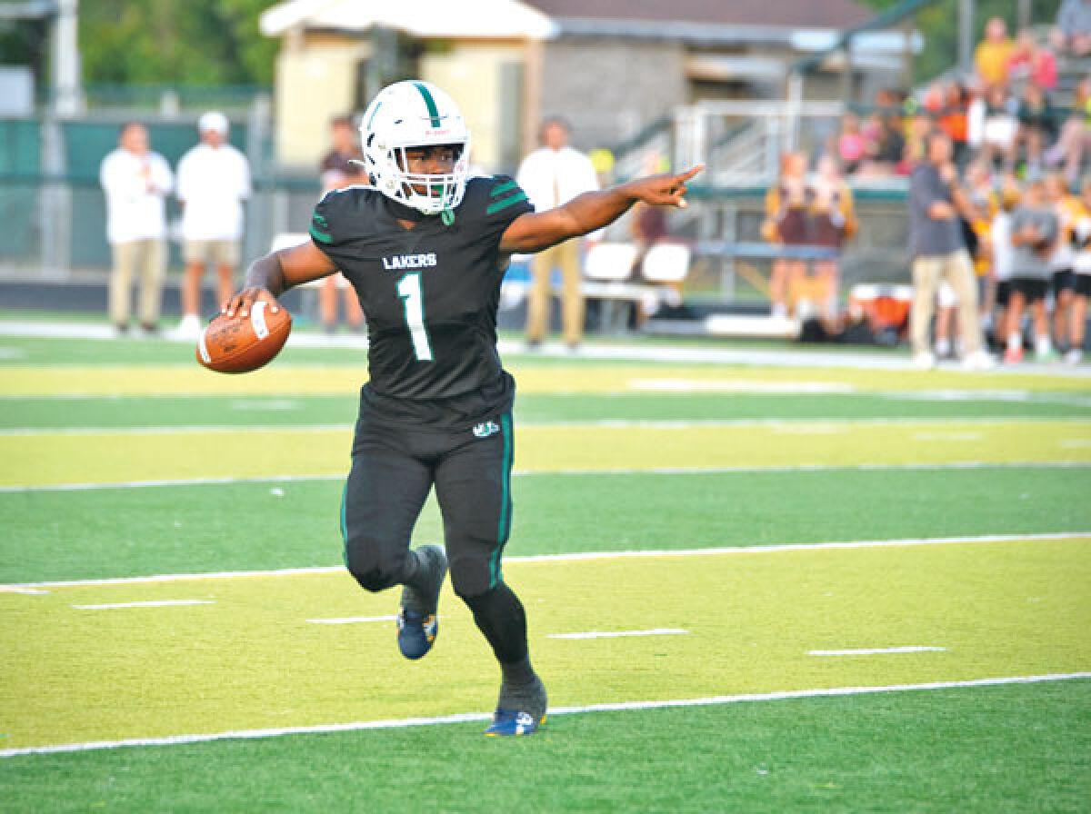  West Bloomfield senior quarterback Reqez Nance looks for an open receiver during West Bloomfield’s 36-32 win over Rochester Adams Sept. 22 at West Bloomfield High School. 