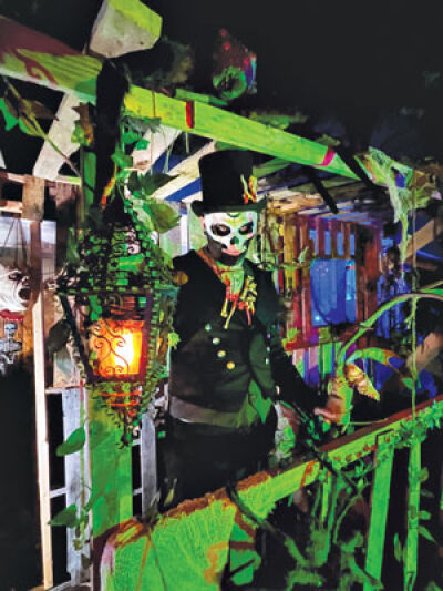  Michael Miller is all dressed up and posing outside his home during the Halloween Tour in a previous year. 