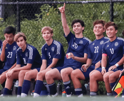  Country Day players cheer on their teammates in their 9-0 win over Detroit Renaissance. 