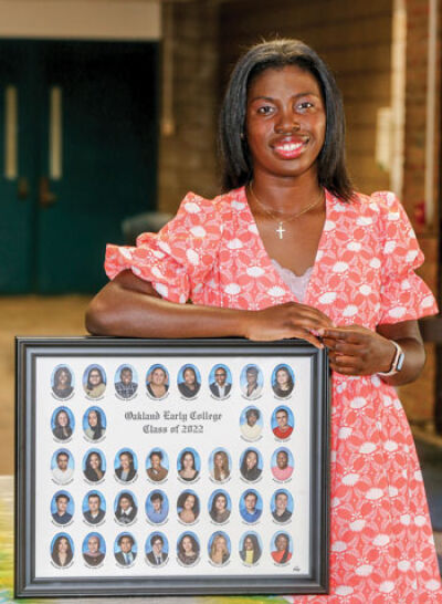  Recent Oakland Early College graduate and West Bloomfield resident Adedoyin Adebayo has been accepted into Harvard University. She is pictured with her graduating class photo from the Oakland Early College program. 