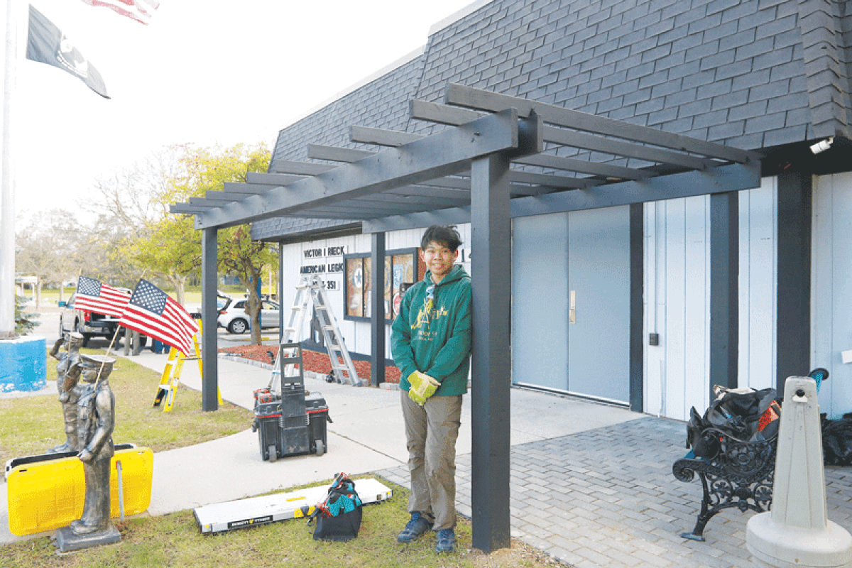   Troop 90 Life Scout Marcus Arambulo stands with the pergola at American Legion Post 351 in Utica Oct. 7. Arambulo led the building of the pergola for his Eagle Scout project. 