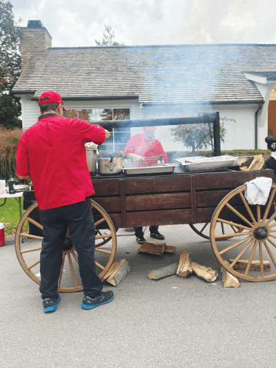  Friends of Franklin Public Library’s Oktoberfest had a red oak  wood-burning chuck wagon out front.  