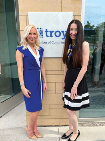  On Oct. 4, the Troy Chamber of Commerce and Walsh College cut the ribbon on the chamber’s new office space on the college’s campus. Pictured, Troy Chamber of Commerce president and CEO Tara Tomcsik-Husak, left, and Walsh College president and CEO Suzy Siegle celebrate the new partnership. 