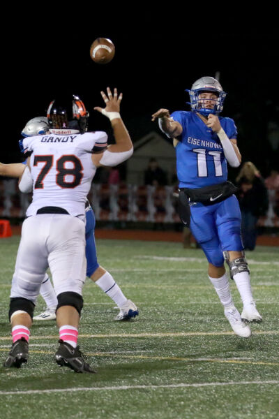  Eisenhower senior quarterback Preston Crum fires a pass during Eisenhower’s 34-7 win over Utica. 