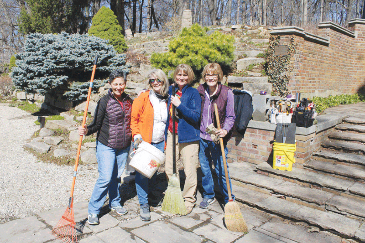  Volunteers conduct a spring cleanup around the gardens at  the Meadow Brook estate. Pictured are Marianne Raffin,  Judy Workings, Nancy Collins  and Joan Kulka.  