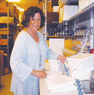  Stephanie Yashinsky, of  Bloomfield, volunteers in the Museum Shop at the Detroit Institute of Arts, helping visitors to select items and packaging their purchases.  