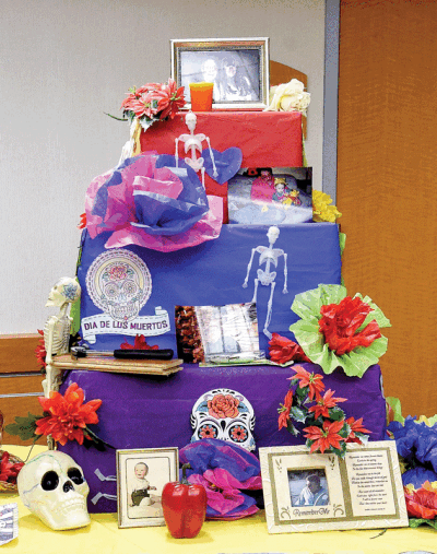 Day of the Dead altars are decorated with flowers, sugar skulls and items that represent the lives of deceased loved ones. 
