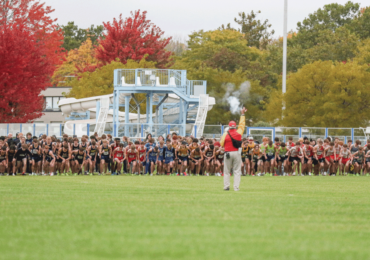  The boys cross country field of more than  200 runners takes off during the championship. 